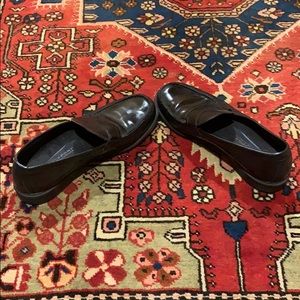 Rockport penny loafers with some minor scratches.